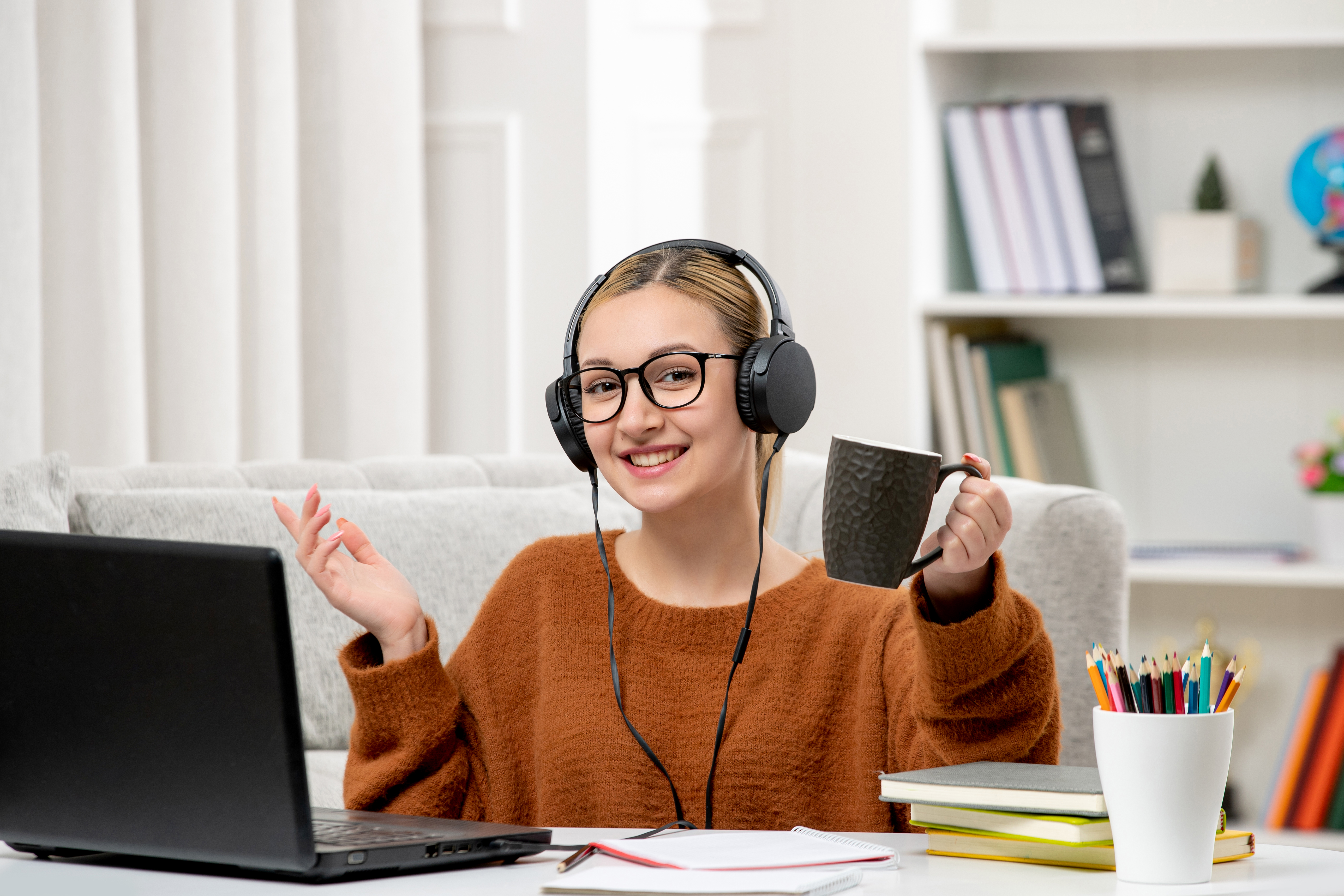 student-online-cute-girl-glasses-sweater-studying-computer-holding-coffee-cup.jpg